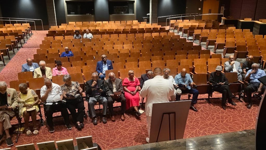 Octogenarian Recognition Luncheon — attendees seated in auditorium